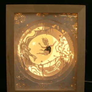 le grand saut. veilleuse ou lampe de chevet. décor en papier découpé à la main. version eclairée